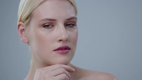 Blond Haired Woman Smiling in a Close Up Shot