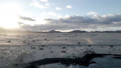 Desert Road Meets Ocean at Sunset Aerial View