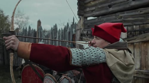 Medieval Warriors Prepare With Bows and Arrows