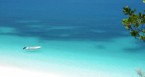 Rent pleasure boat in blue water on Fteri beach, Kefalonia Island, Greece.
