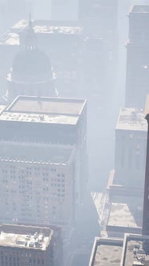 Vertical Aerial View of Modern Cityscape in Hazy Weather