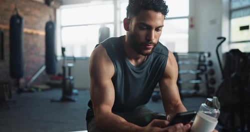 Man, gym and smile with smartphone for fitness on social media, networking and communication