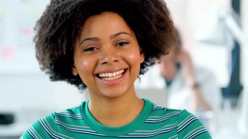 Business and People Concept - Portrait of Smiling African Woman at Office Adult