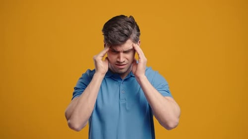 30s Aged Man in Blue Wear Having Headache Studio Portrait Guy Putting Hands on Head Isolated on