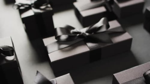 Elegant Gift Boxes with Black Bows in Studio Setting