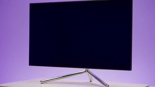 Modern Computer Monitor Rotating on a Colorful Background