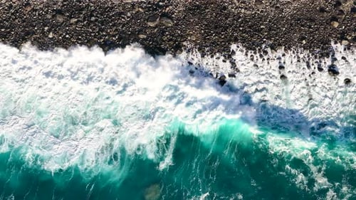 Explore the stunning coastal waves and rocky shoreline of Madeira Island