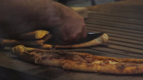 Man Making Turkish Pizza Lahmacun with Minced Llamb and Beef in Istanbul Cafe