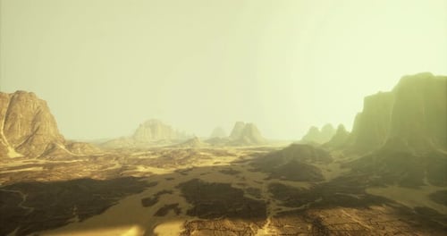 Expansive Desert Landscape with Towering Cliffs Under a Hazy Sky
