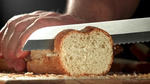 The Chef Slices Fresh Bread Filmed on a Highspeed Camera at 1000 Fps
