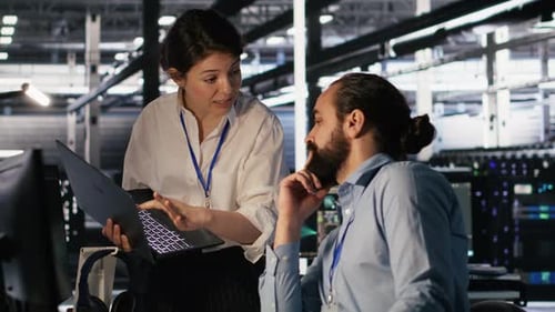 Data Center Admins Working Together Collaborating on AI Software Development