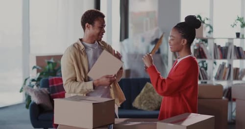 Young Couple Celebrates Buying New House