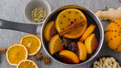Christmas and Seasonal Drinks Concept - Pot with Hot Mulled Wine, Orange