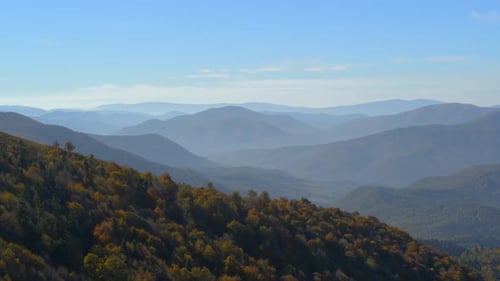 Flight Over Mountains with Autumn Forests
