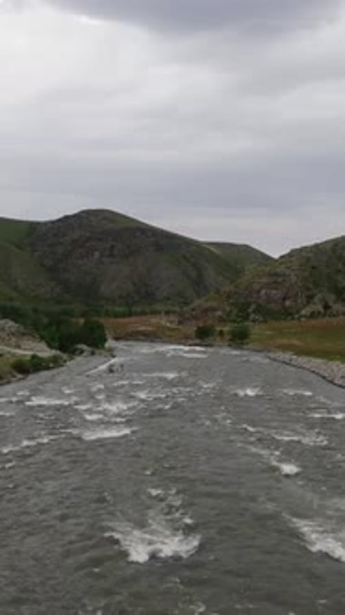A Bubbling Mountain River In Summer. Vertical Format