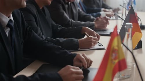 Formal Meeting with International Flags and Professionals