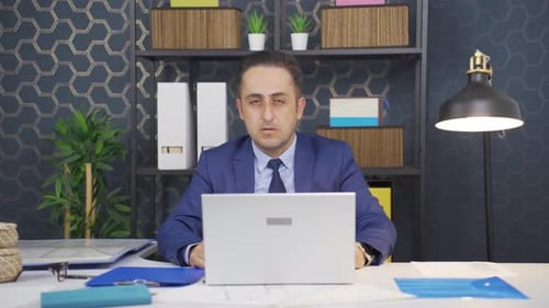 Adult Man Working on Computer in Office
