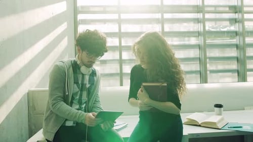 Young Students with Tablet in a Library