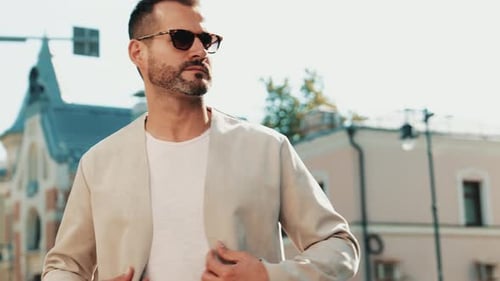 Stylish Man Walking in the City on Sunny Day