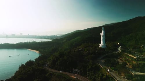 Towering Lady Buddha Statue Perched on Hillside Near Da Nang Bay Revealing Sweeping Landscape with