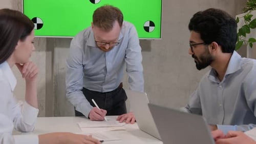 Collaborative Team Meeting in Modern Office Space