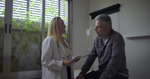 Doctor Talking with Patient in Exam Room