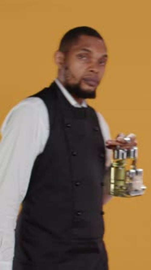 Expressive Young Adult Gesturing with Condiment Set