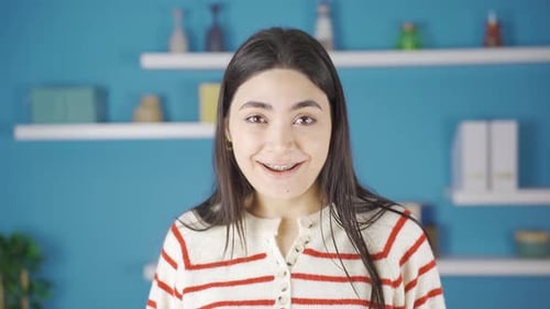 Cheerful Woman Smiling with Braces in Home Interior