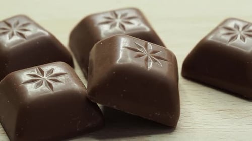 Chocolate cubes pieces, square chocolate candy.