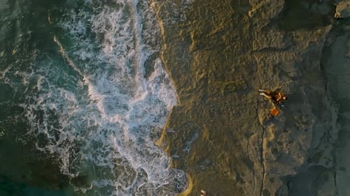 Man on a Beach is Looking Distance During Beautiful Summer Sunset