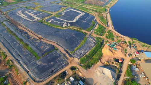 4K : Aerial view from a drone flying over a large pile of garbage