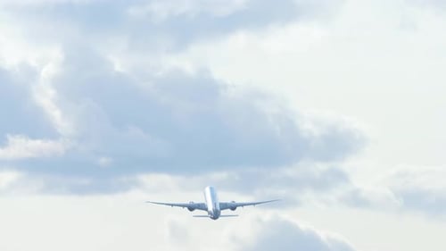 Rear View of an Airplane Gaining Altitude