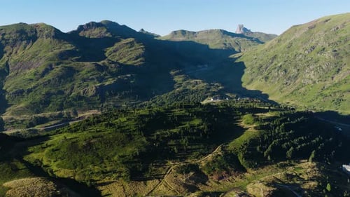 Aerial View Flying Over Green Mountain Valley Landscape
