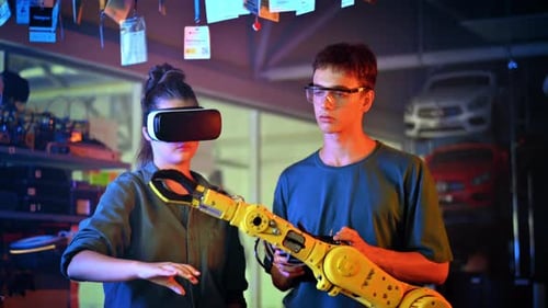 Teens Using VR to Control Robotic Arm