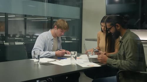 Young Adults Working Together in Modern Office