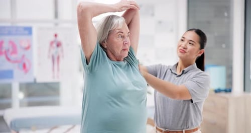 Woman Stretching with Therapist Guidance in Clinic