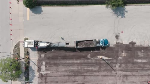 Group of Construction Workers Shredded Old Asphalt on Parking Lot and Roadway Top Down Wide Shot