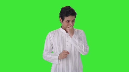 Sick Indian man suffering from cold and cough Green screen