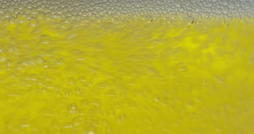 golden icy cold beer in extreme macro foam. clear beverage and bubbles of carbon dioxide.
fresh b