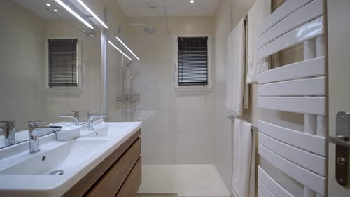 Cinematic slider shot of luxury White Bathroom Interior of a hotel.