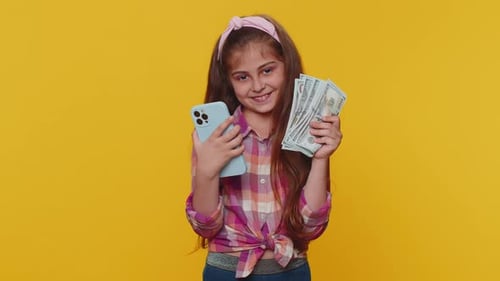 Happy Girl Holding Phone and Fan of Cash