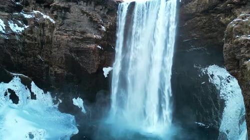 View of Frozen Skogafoss Waterfall Filled with Snow in Winter in Iceland