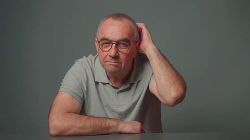 Mature Man Has Eureka Moment Pointing Finger Up