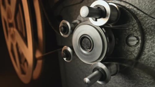 Vintage 8Mm Film Projector Rotating Reels Nostalgic Charm of Classic Cinema