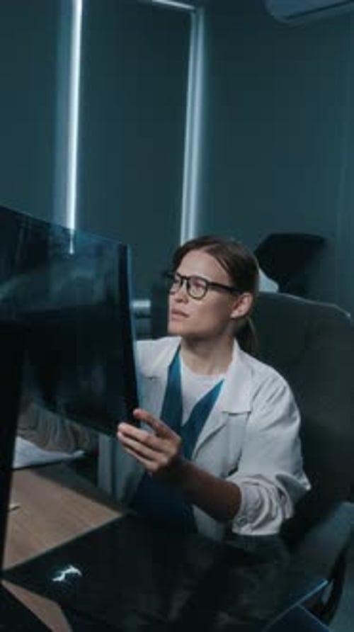 Woman Doctor Examining X-ray in Modern Office