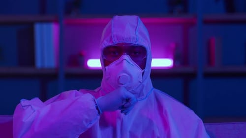 Person in Protective Suit Thumbs Down