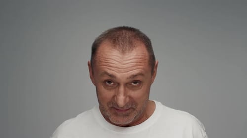 Portrait of Adult Man Raising Old Head Looking at Camera Smiling and Laughing