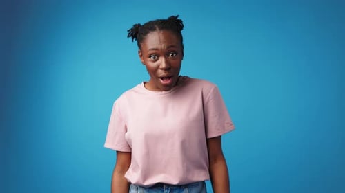 Woman Expressing Shock and Surprise in Studio Shot
