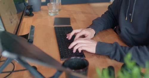 Man typing on the computer inside the office