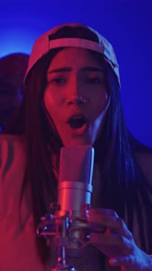 Young Singer Performing with Microphone in Slow Motion